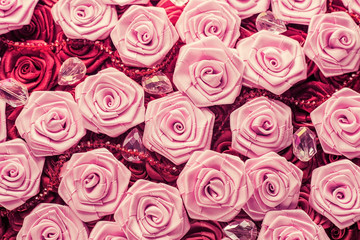 Wedding background with red and light pink silky roses, decoration of the wedding party