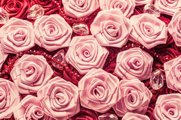 Wedding background with red and light pink silky roses, decoration of the wedding party, delicate bride and bridesmaids texture