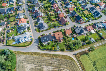 Typical German new housing development in the flat countryside of northern Germany between fields...