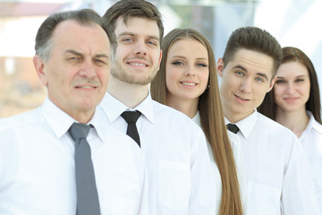 group of young business people standing in a row.