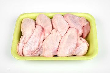 raw chicken wings package isolated on white background