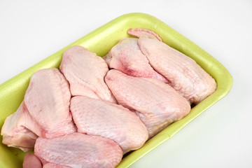 raw chicken wings package isolated on white background
