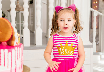 little girl and birthday cake