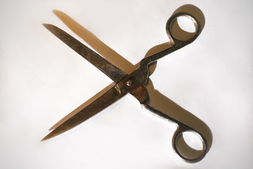 old scissors.isolated on a dark background