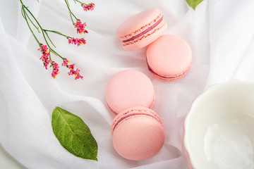 Pink strawberry macarons. French delicate dessert for Breakfast