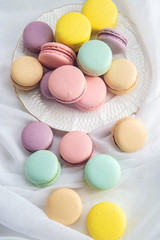Colorful macarons on a white background. French dessert