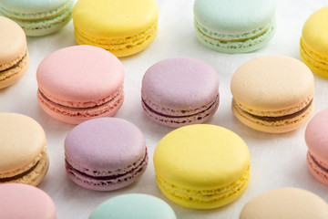 Colorful macarons on a white background. French dessert