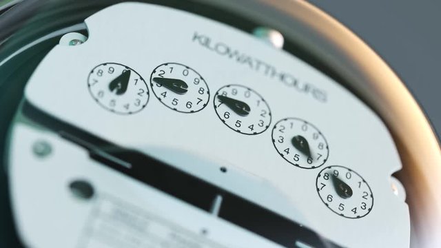 Analog electricity meter showing household consumption. power watt energy KWh