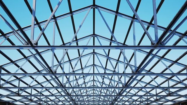 Seamless looping shot with camera moving along the unfinished steel roof