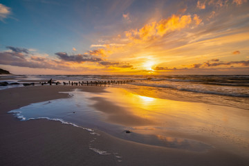 Fototapeta na wymiar Romantic, colorful sunset over the sea beach, baltic sea, Poland