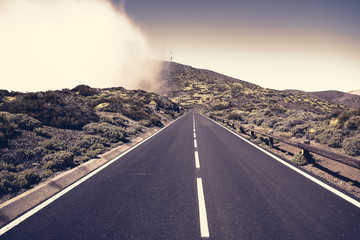 asphalt road running at the foot of the volcano