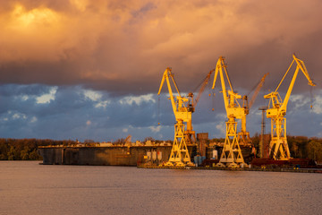 stormy clouds at sunset above the shipyard, repair yard in Szczecin