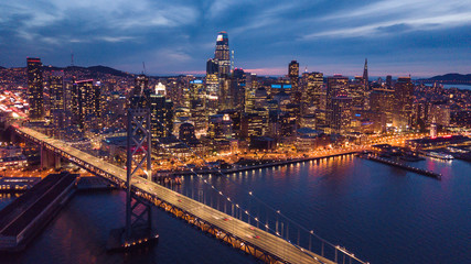 Aerial Cityscape view of San Francisco and the Bay Bridge at Night