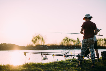 Fishing as recreation and sports displayed by fisherman at lake