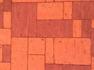 Orange paving stones, tile, brick, geometric shapes abstract texture background.