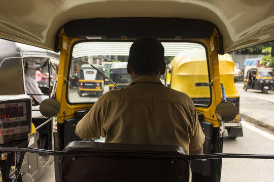View from the inside of an auto-rickshaw as a passenger in Mumbai, India