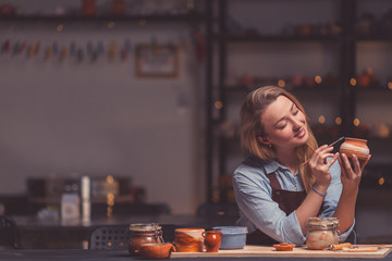 Attractive girl drawing in a workshop
