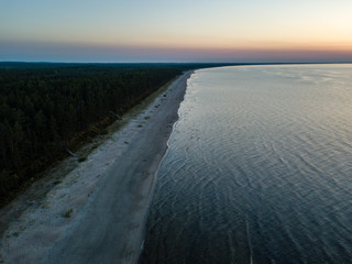Fototapeta premium drone image. aerial view of red sunset in the sea. shore line