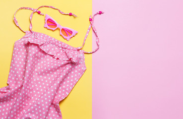 Pink summer dress on colorful background