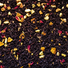 Citrus tea. The orange flavor. Tea with lemon and orange. Assorted flavors. Dried blue cornflower and orange slices. Scattered welding