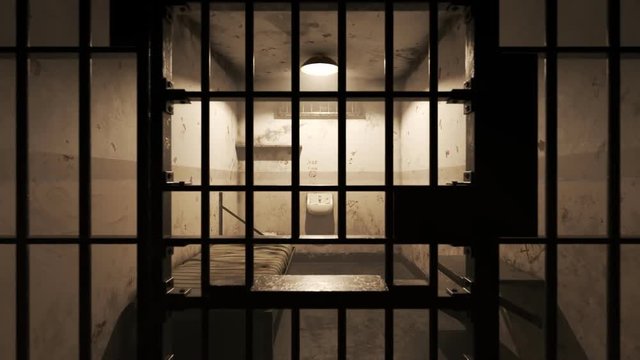 Old grunge dirty prison cell seen through jail bars. The dolly zoom effect.