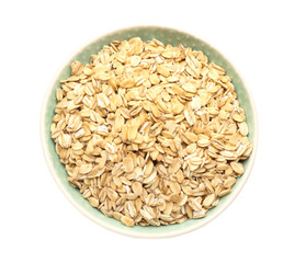 Bowl with raw oatmeal on white background