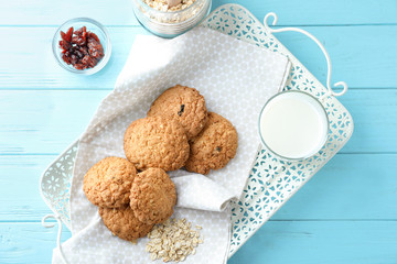 Composition with delicious oatmeal cookies on wooden background