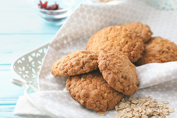 Tray with delicious oatmeal cookies on wooden background, closeup