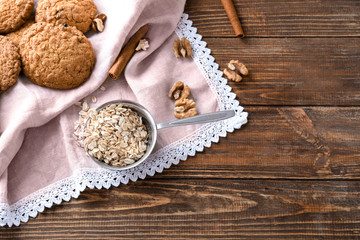 Composition with delicious oatmeal cookies on wooden background