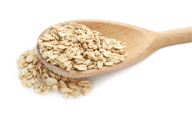 Spoon with raw oatmeal on white background