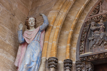 madonna figure on ancient church wall © rudolfgeiger