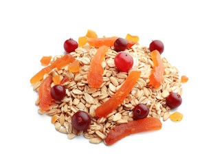 Heap of raw oatmeal, dried apricot and cranberries on white background