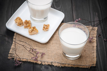 Milk glass on wooden table. Healthy eating concept
