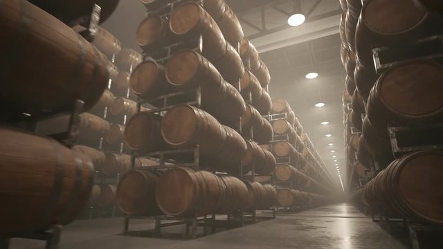 Alcohol storage. Old whiskey or wine barrels stacked in rows at the warehouse.