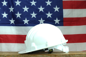 Safety helmet with USA flag at background.    