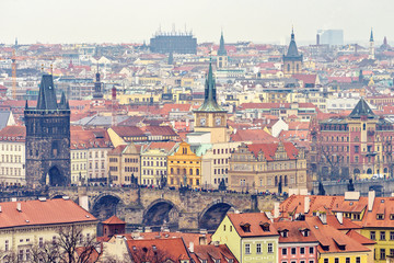 Obraz premium Cloudy day aerial view to clay pot roofs of Prague