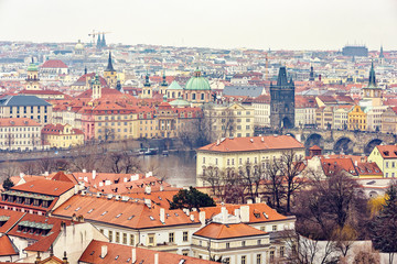 Fototapeta premium Cloudy day aerial view to clay pot roofs of Prague