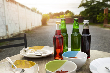 Refreshing drinks and dish on desk family party in backyard