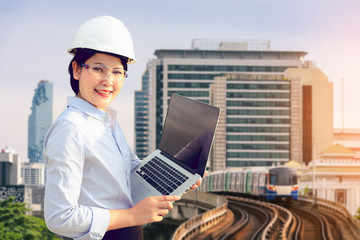 Portrait of service engineer woman with holding laptop, Engineering and business concept