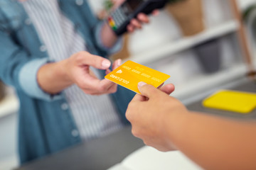 Non cash payment. Selective focus of a credit card being used for making non cash payment