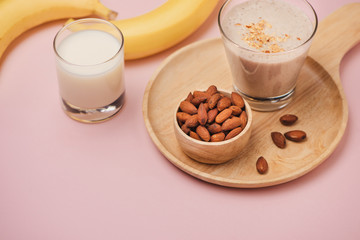 Fresh made Banana smoothie on pink background