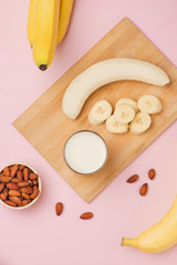 Fresh made Banana smoothie on pink background