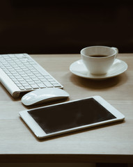 office workplace keyboard and coffee cup  on office work table in working today