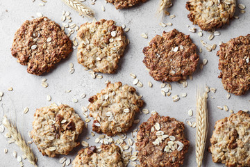 Delicious oatmeal cookies on light background