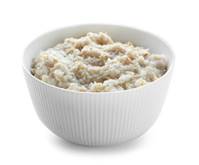 Tasty oatmeal in bowl on white background