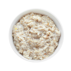 Tasty oatmeal in bowl on white background