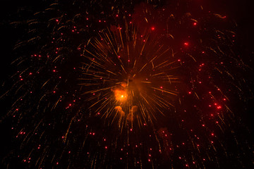 Fototapeta na wymiar Gold and red fireworks
