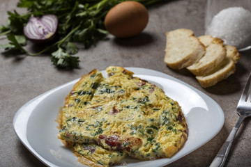 Omelet made from eggs, bacon, cheese and onion