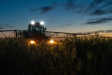 Machine for spraying pesticides and herbicides in the field at night. 