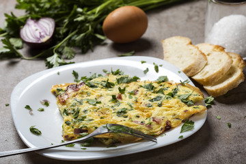 Omelet made from eggs, bacon, cheese and onion
